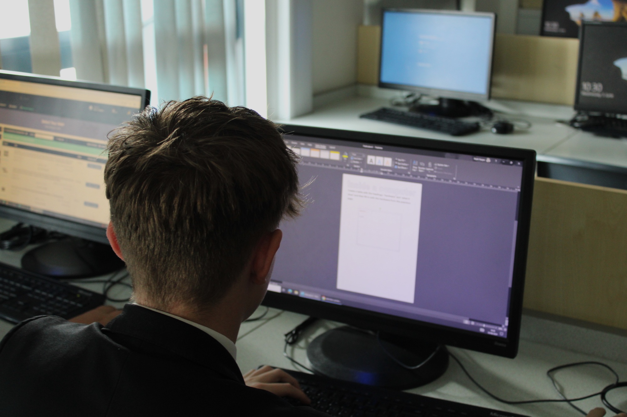A student using the computer in their ICT lesson.