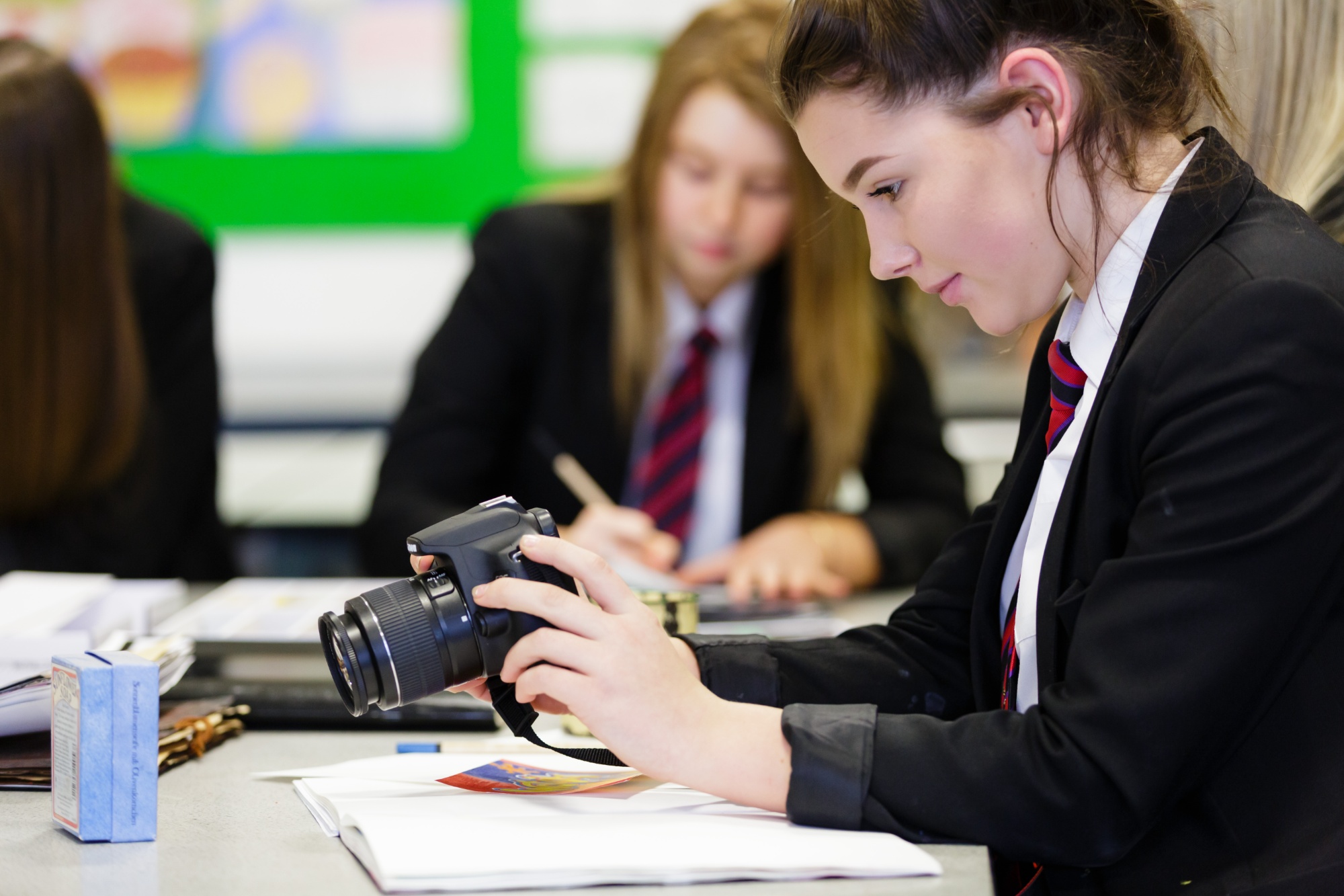 A student using a camera.