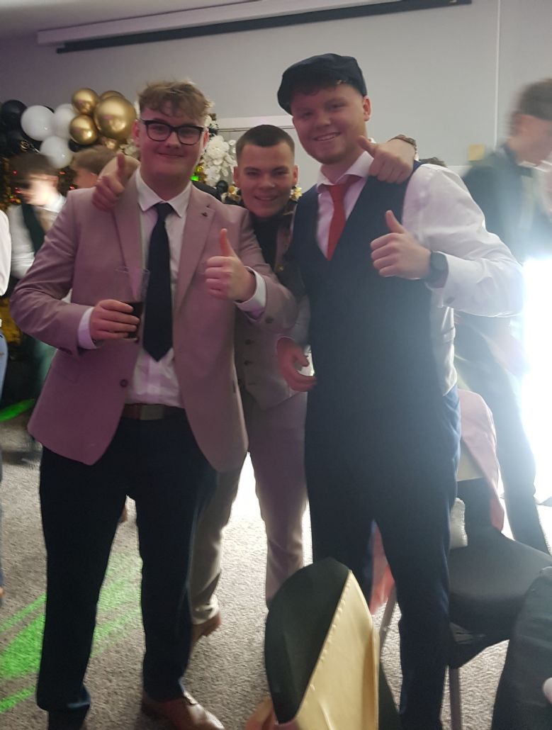 Three pupils celebrating prom at the disco.